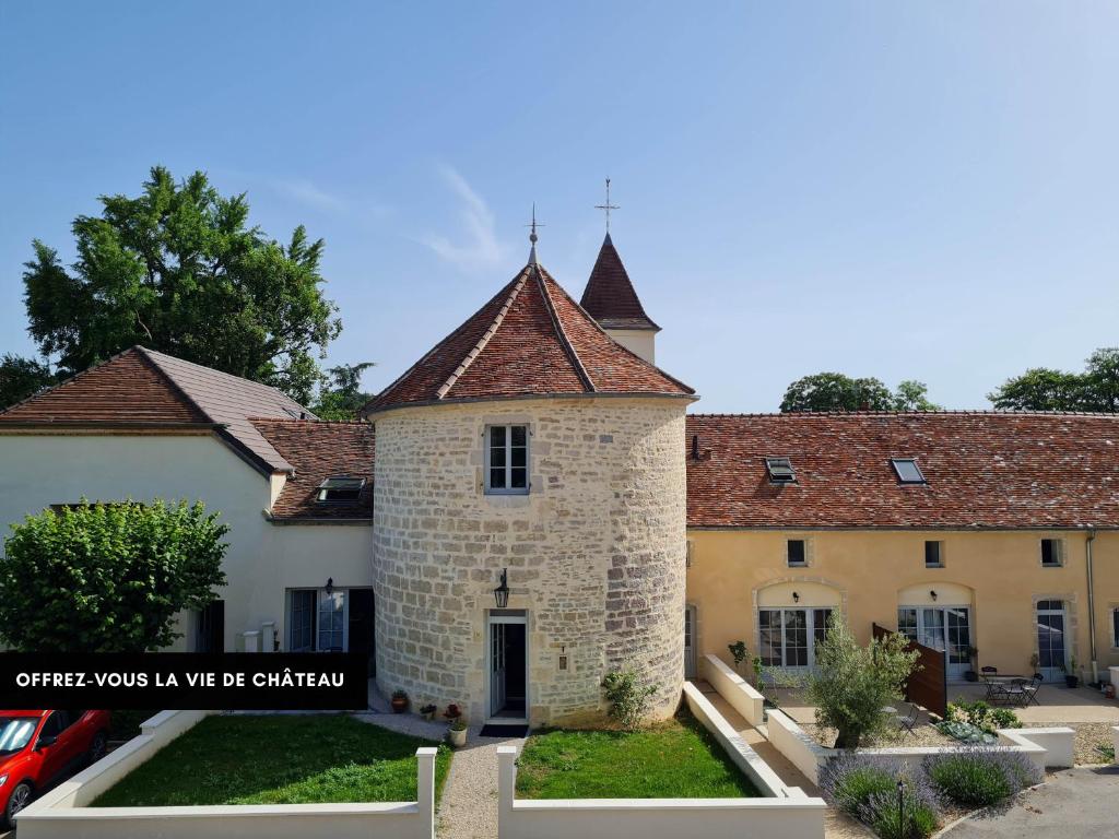 an old stone building with a turret at Tour de Lacuzon in Dole