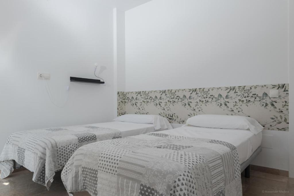 Posteľ alebo postele v izbe v ubytovaní Gran Villa Roquetas Beach & Golf Playa Serena