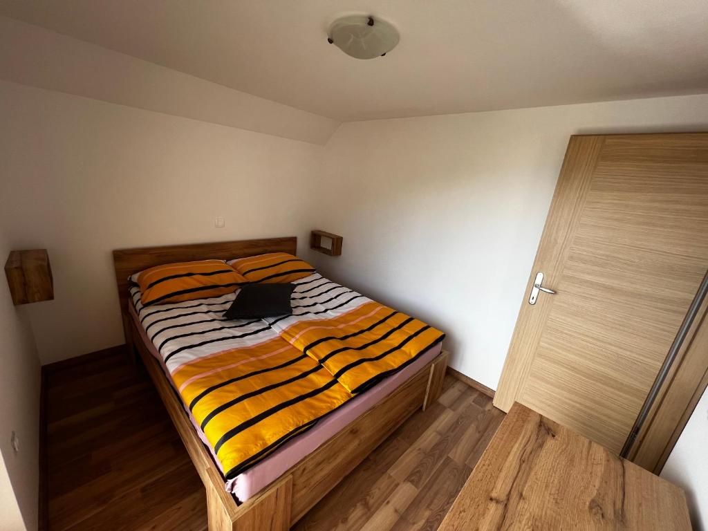 Postel nebo postele na pokoji v ubytování Apartma ELA