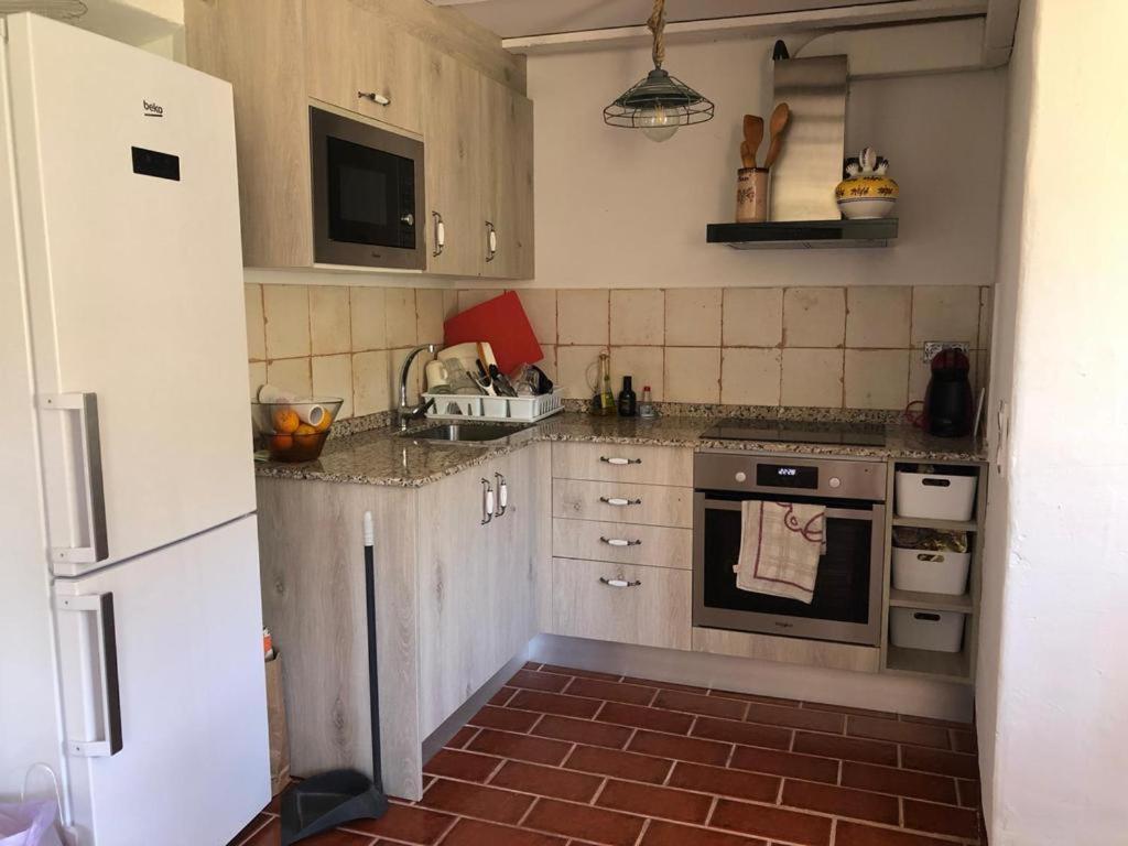 A kitchen or kitchenette at Cal Tató Apartament