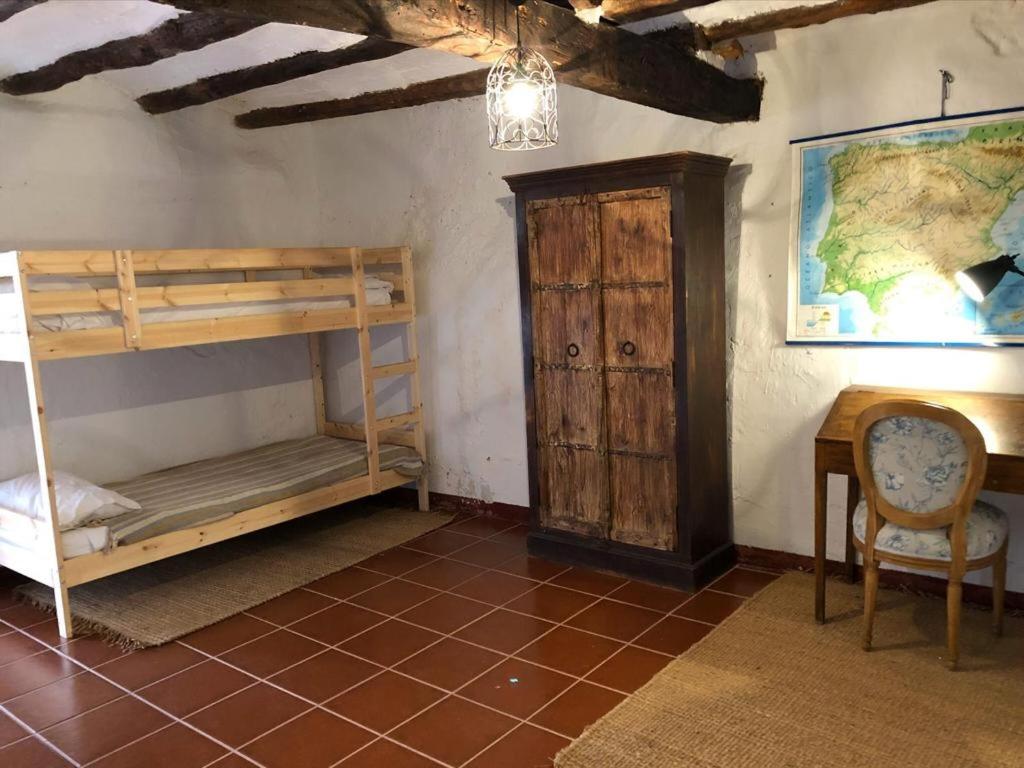 A bed or beds in a room at Cal Tató Apartament