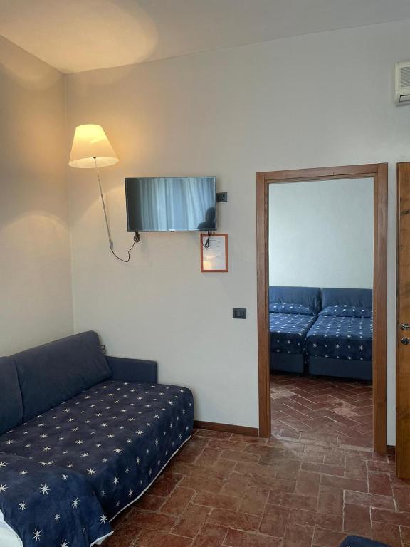 Posteľ alebo postele v izbe v ubytovaní Locanda del Glicine