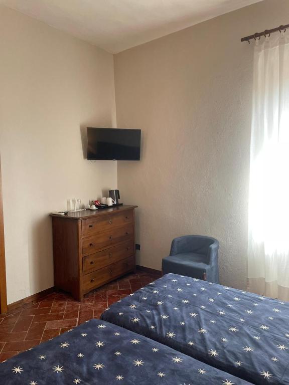 Posteľ alebo postele v izbe v ubytovaní Locanda del Glicine