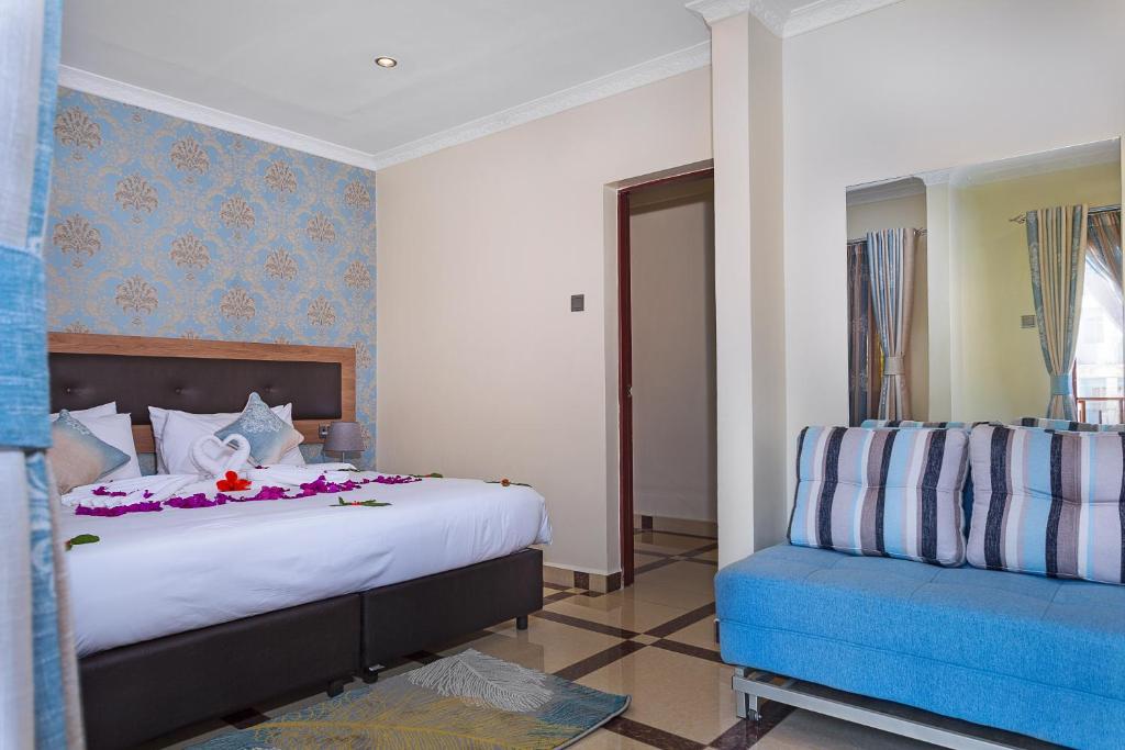 Postel nebo postele na pokoji v ubytování West Lerruat Hotel