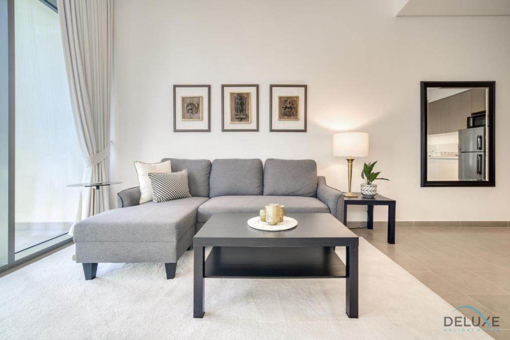 Posezení v ubytování Graceful 1BR at Park Heights Dubai Hills MBR City by Deluxe Holiday Homes