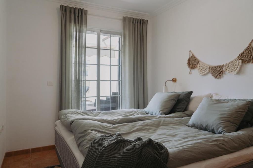Łóżko lub łóżka w pokoju w obiekcie AP378 Casa Maria