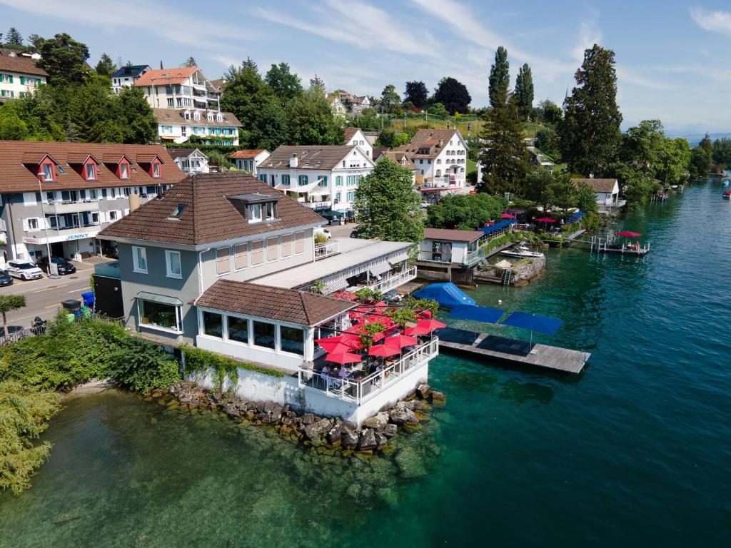 an aerial view of a house on the water at Seeloft - a Sharp Hotel in Herrliberg