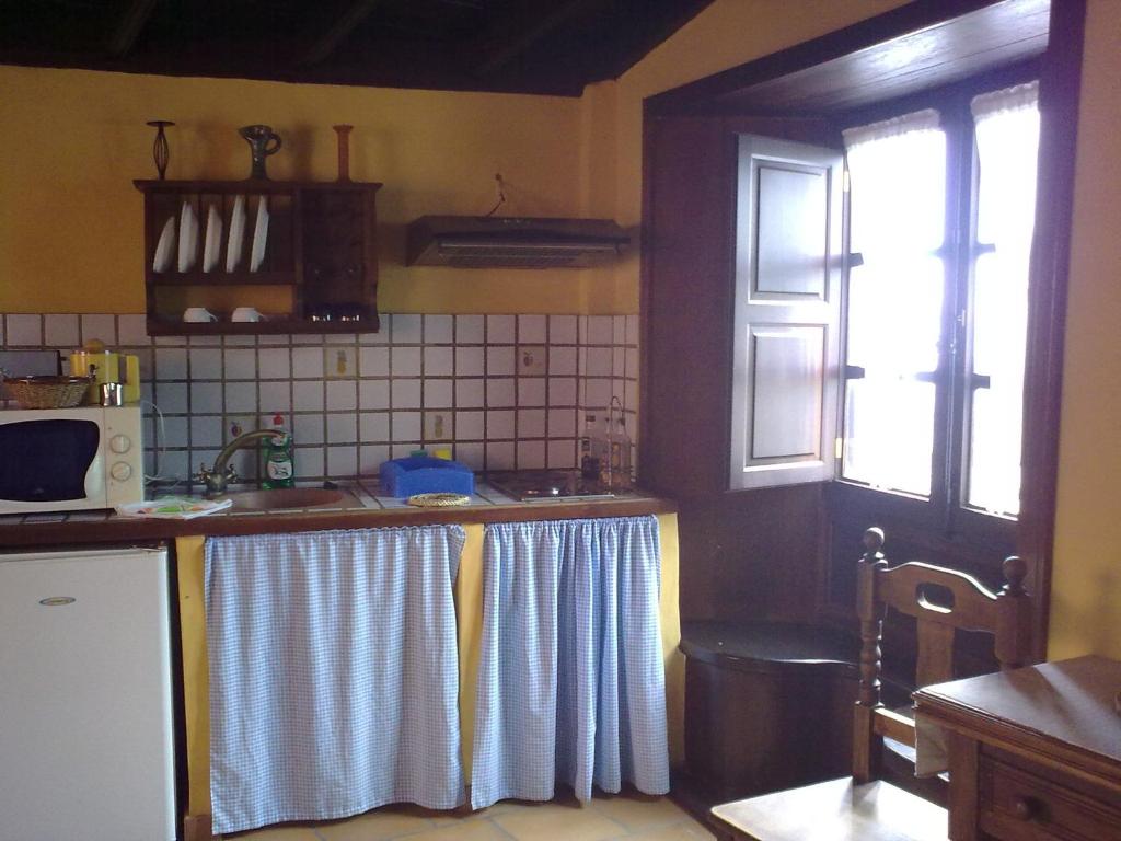 Kuchyň nebo kuchyňský kout v ubytování Casa Ida