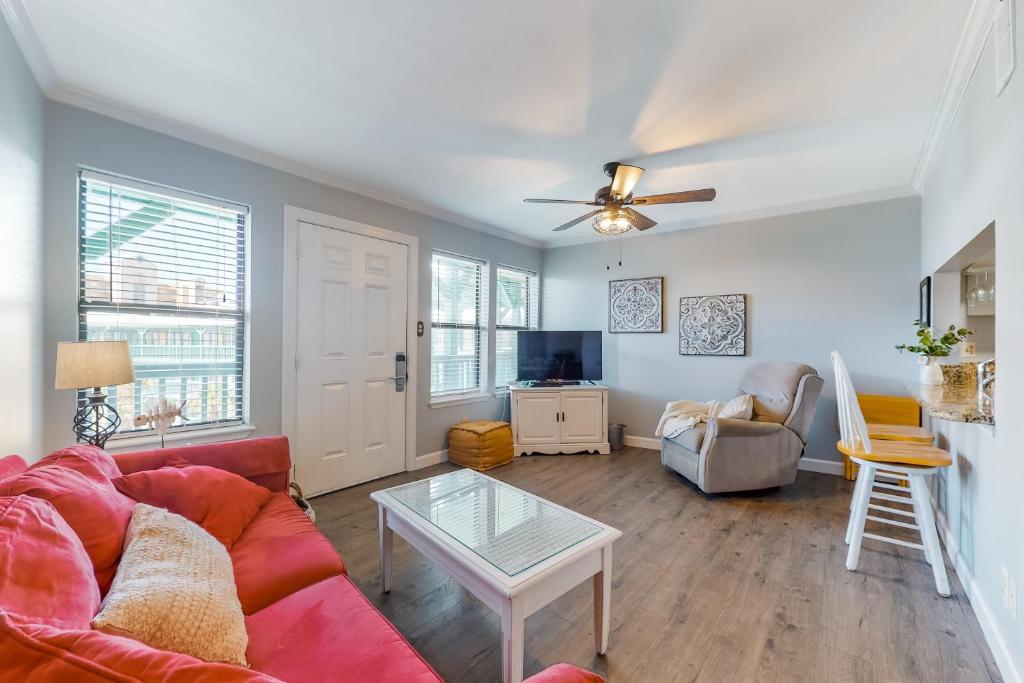 a living room with a couch and a table at Sea Breeze #312 in Gulf Shores