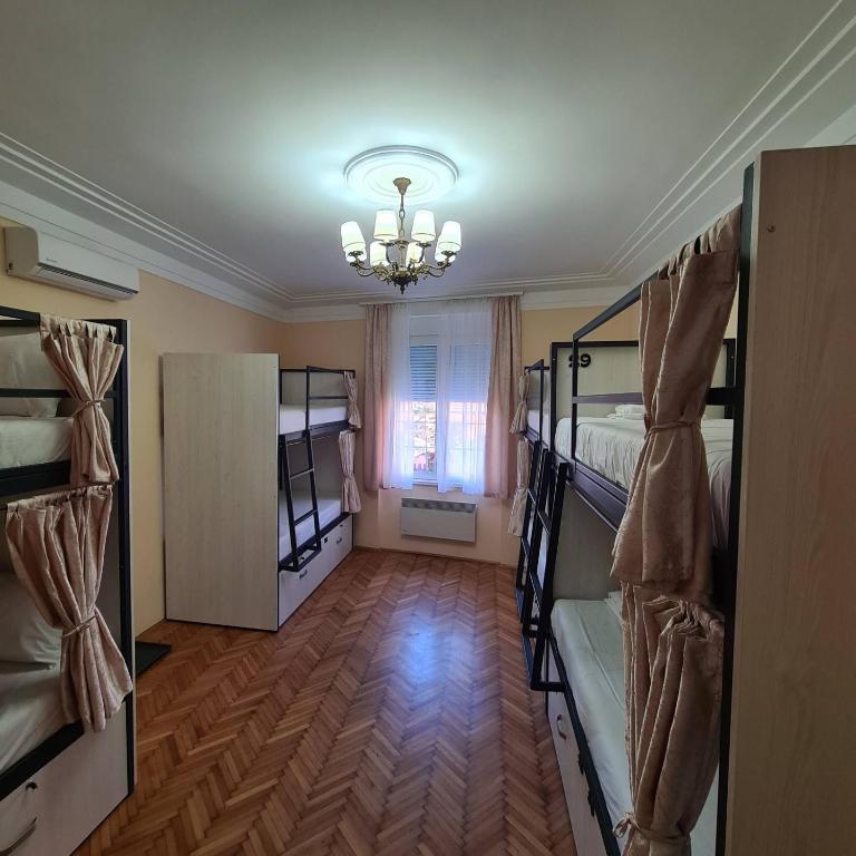 Postel nebo postele na pokoji v ubytování Up Hostel