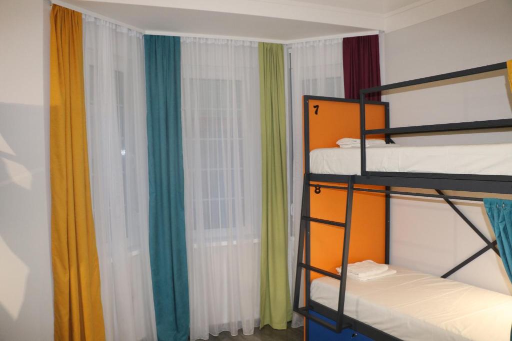 Postel nebo postele na pokoji v ubytování Up Hostel