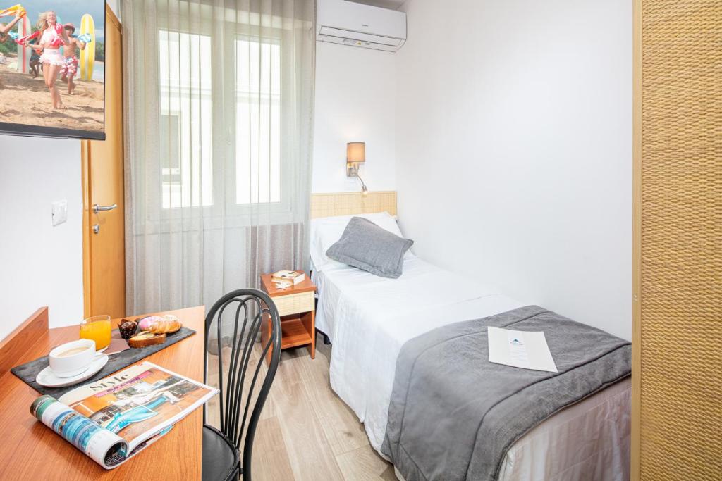 Postel nebo postele na pokoji v ubytování Hotel Villa d'Este