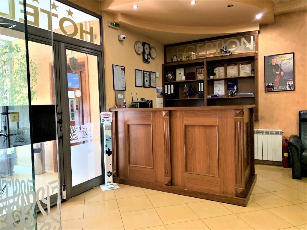 a store front with a wooden bar in a store at Hotel Trayana in Stara Zagora