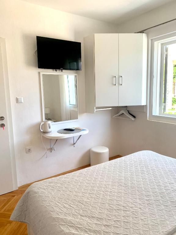Posteľ alebo postele v izbe v ubytovaní Apartments Nikola Stipišić