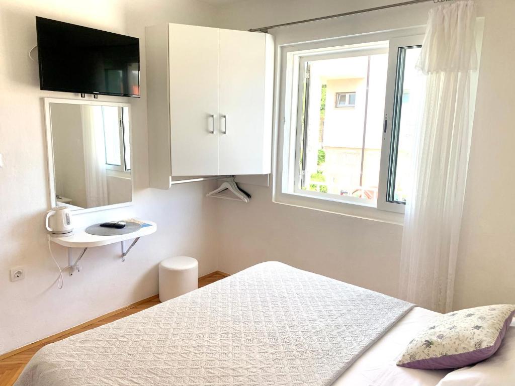 Posteľ alebo postele v izbe v ubytovaní Apartments Nikola Stipišić