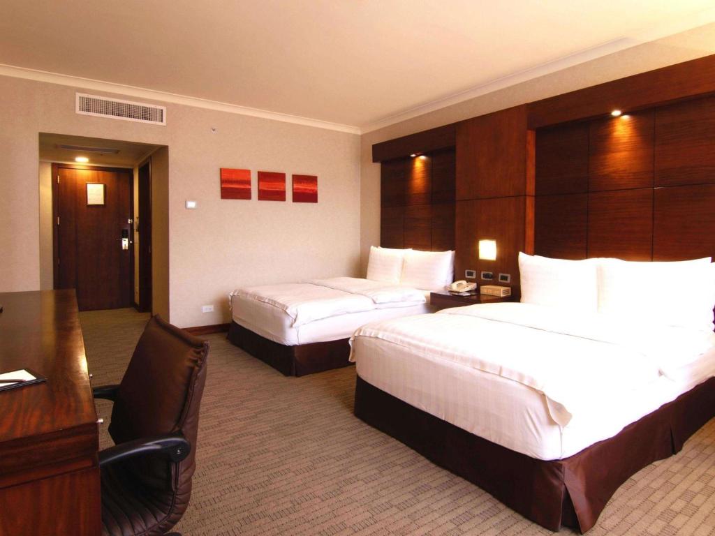 Postel nebo postele na pokoji v ubytování Swissotel Quito