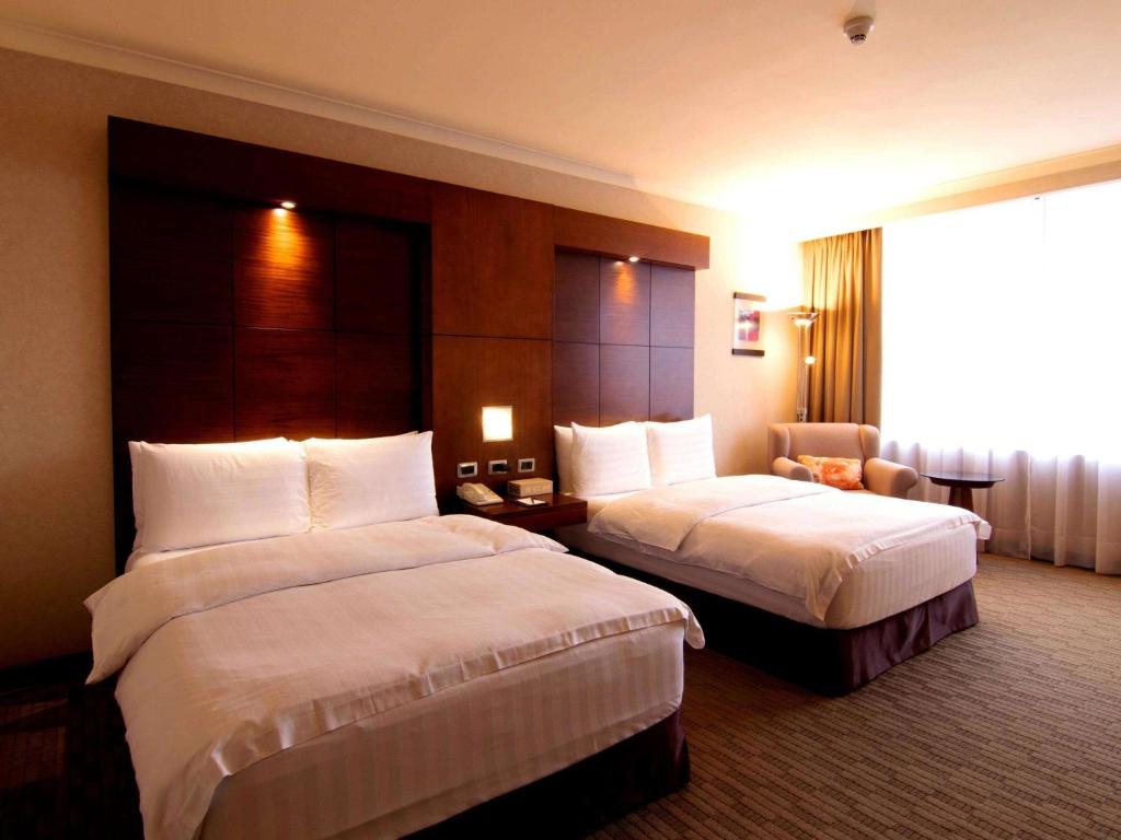 Postel nebo postele na pokoji v ubytování Swissotel Quito