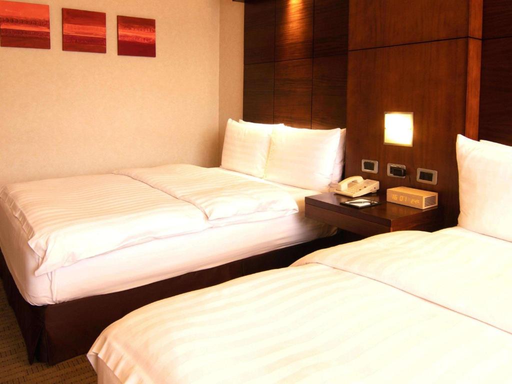Postel nebo postele na pokoji v ubytování Swissotel Quito