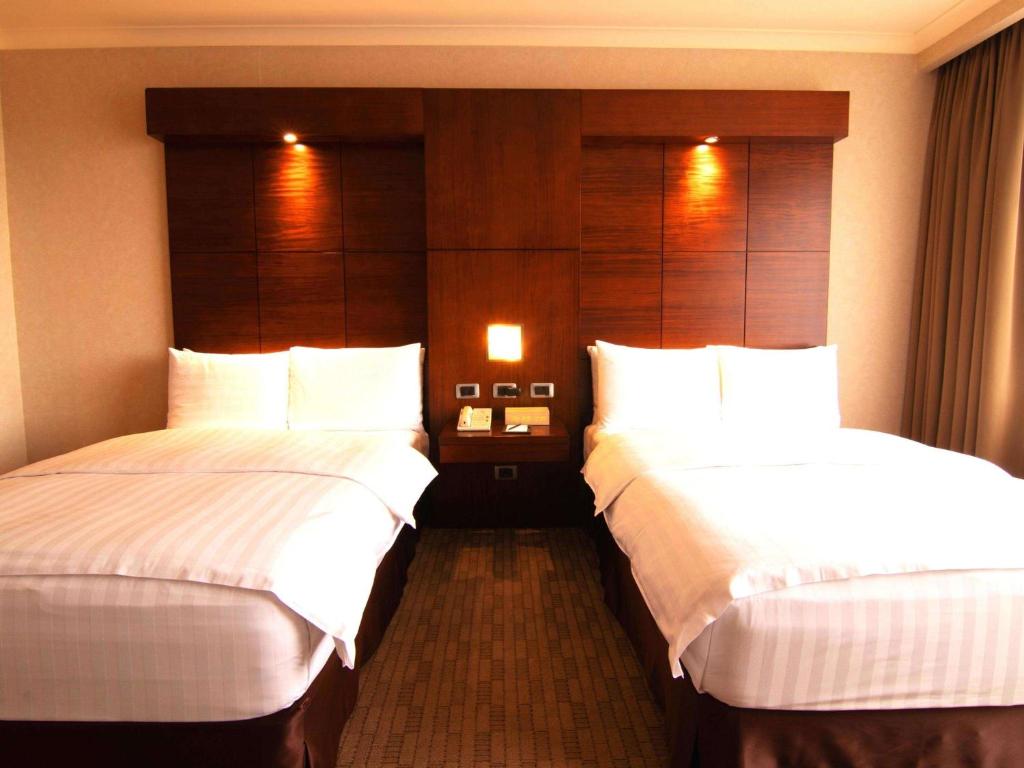 Postel nebo postele na pokoji v ubytování Swissotel Quito