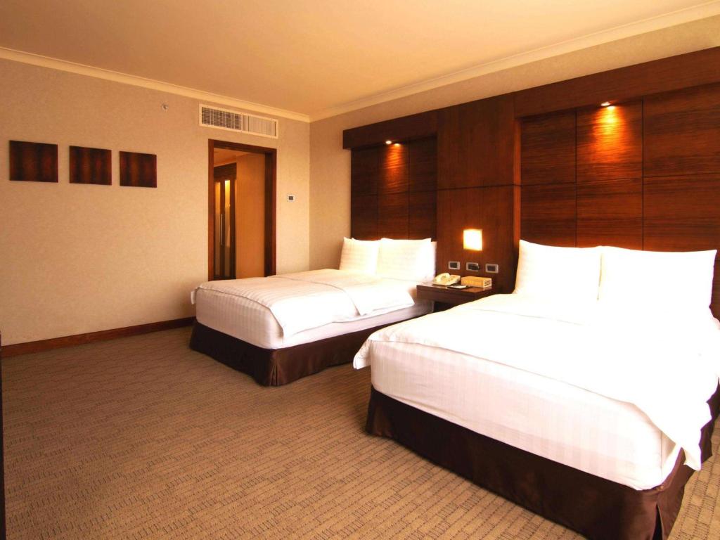 Postel nebo postele na pokoji v ubytování Swissotel Quito