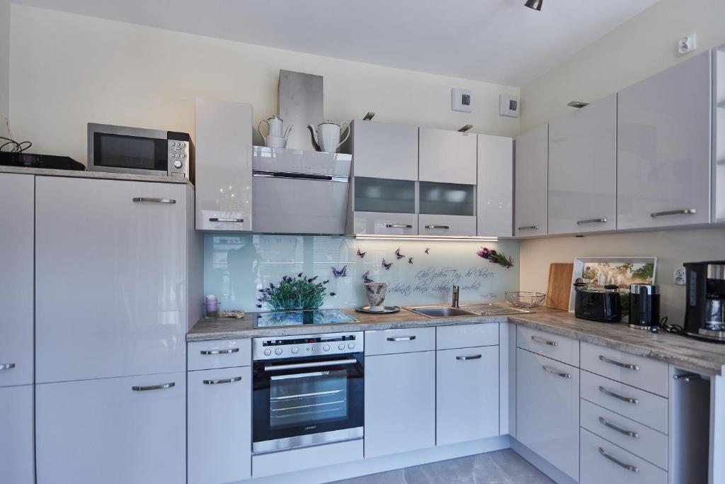 Kuchyňa alebo kuchynka v ubytovaní Apartamenty Świnoujście - Kormoran