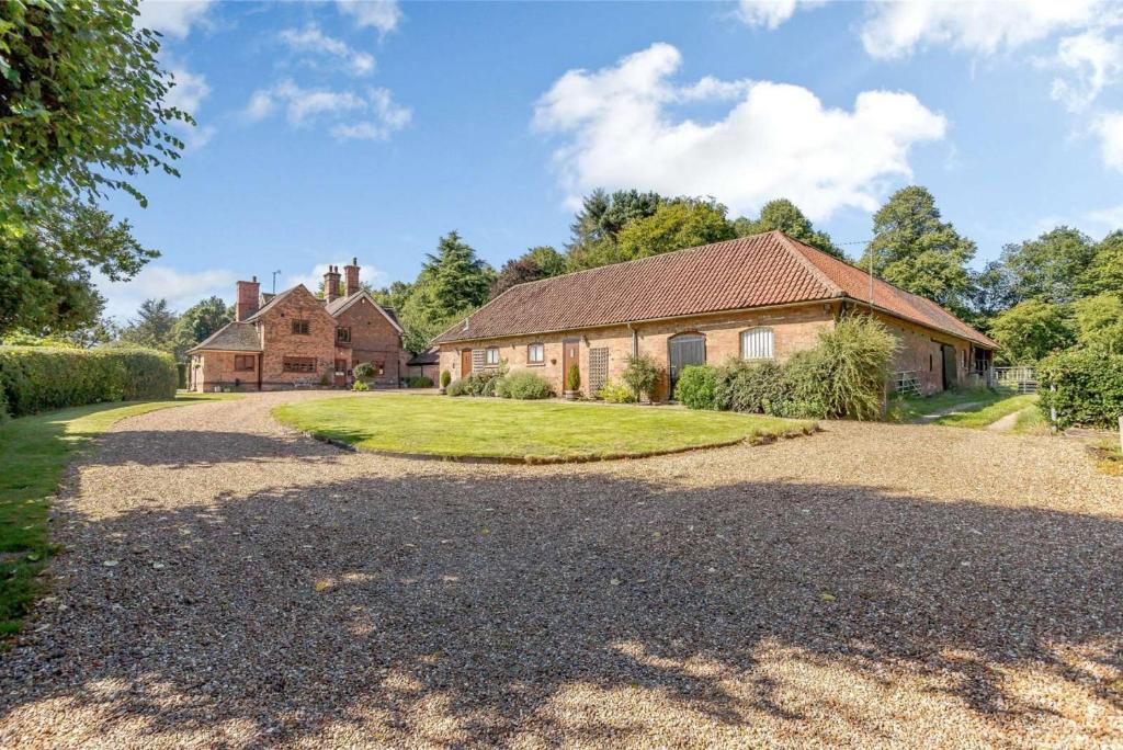 an estate with a large house and a driveway at Holly Lodge Country Guest House in Blidworth