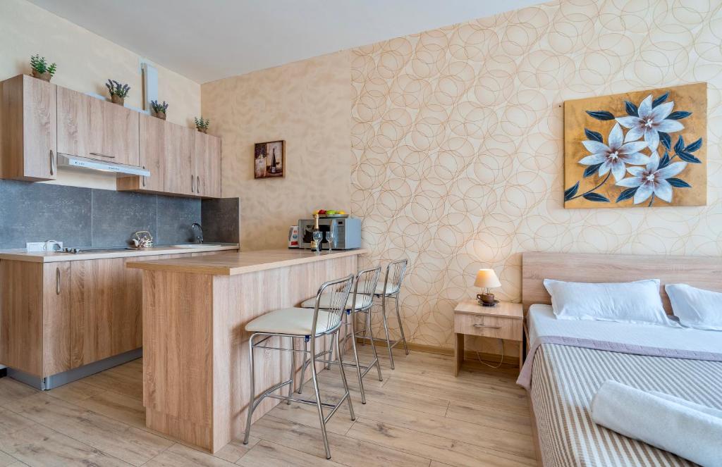 Kuchyň nebo kuchyňský kout v ubytování Studio Apartment NFT New Gudauri 108