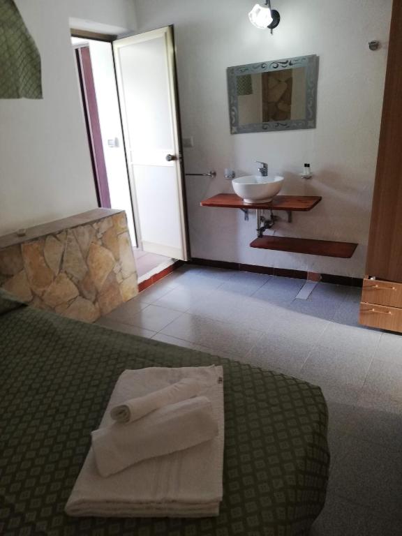 Postel nebo postele na pokoji v ubytování Hotel Villaggio Tabù