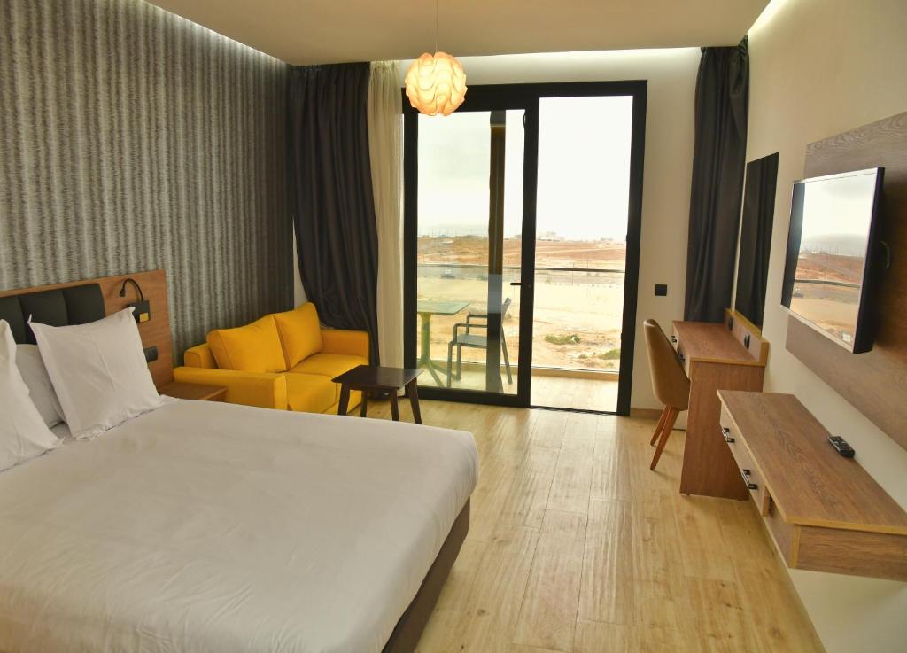 Postel nebo postele na pokoji v ubytování Surf One Hotel