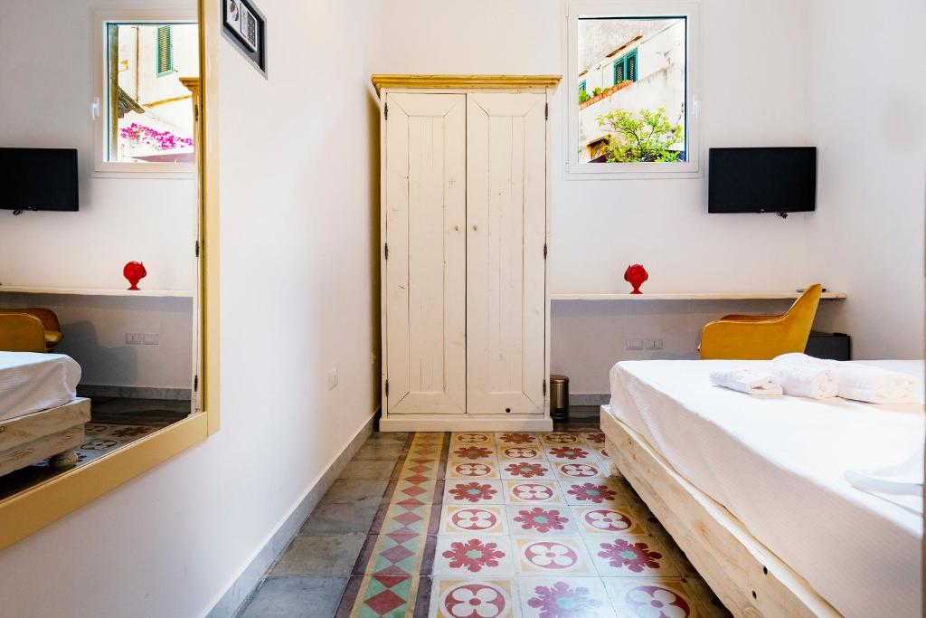 Postel nebo postele na pokoji v ubytování Damasa Rooms