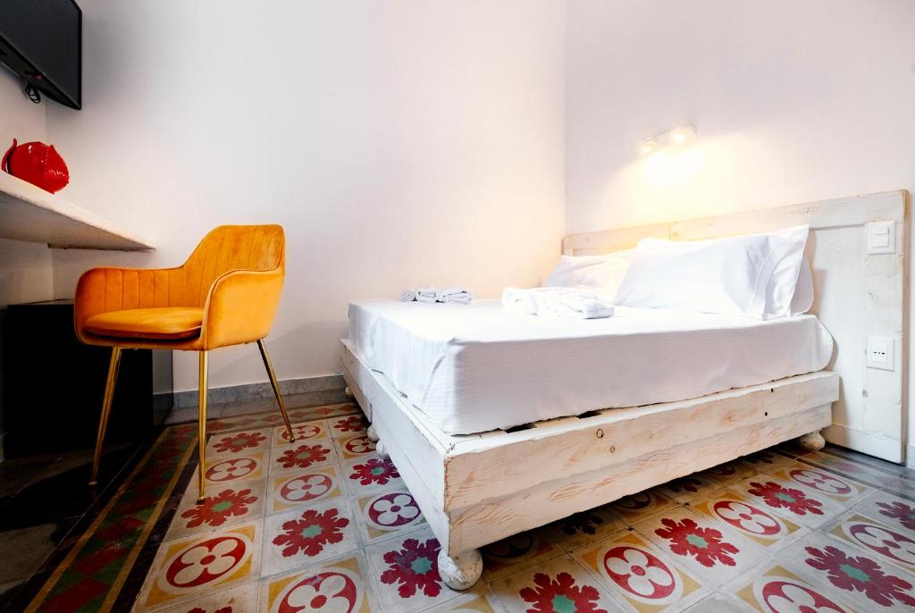 Postel nebo postele na pokoji v ubytování Damasa Rooms
