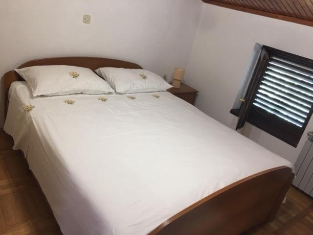 Postel nebo postele na pokoji v ubytování Apartment Nela