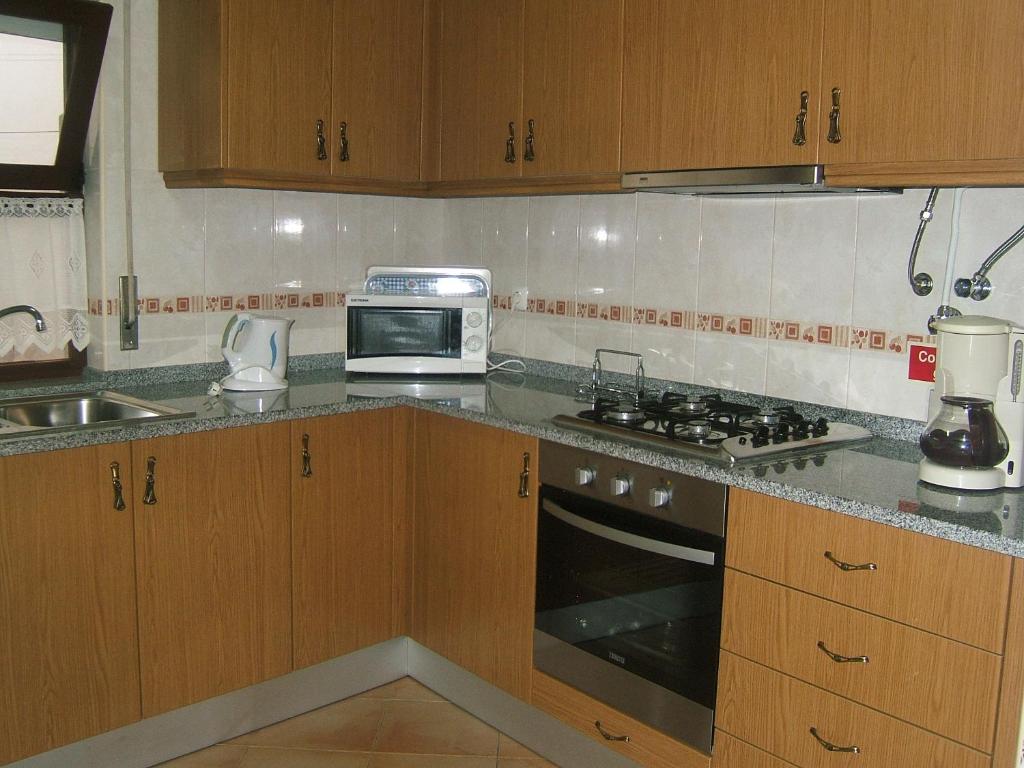 Kuchyň nebo kuchyňský kout v ubytování Villa Oliveira Apartments