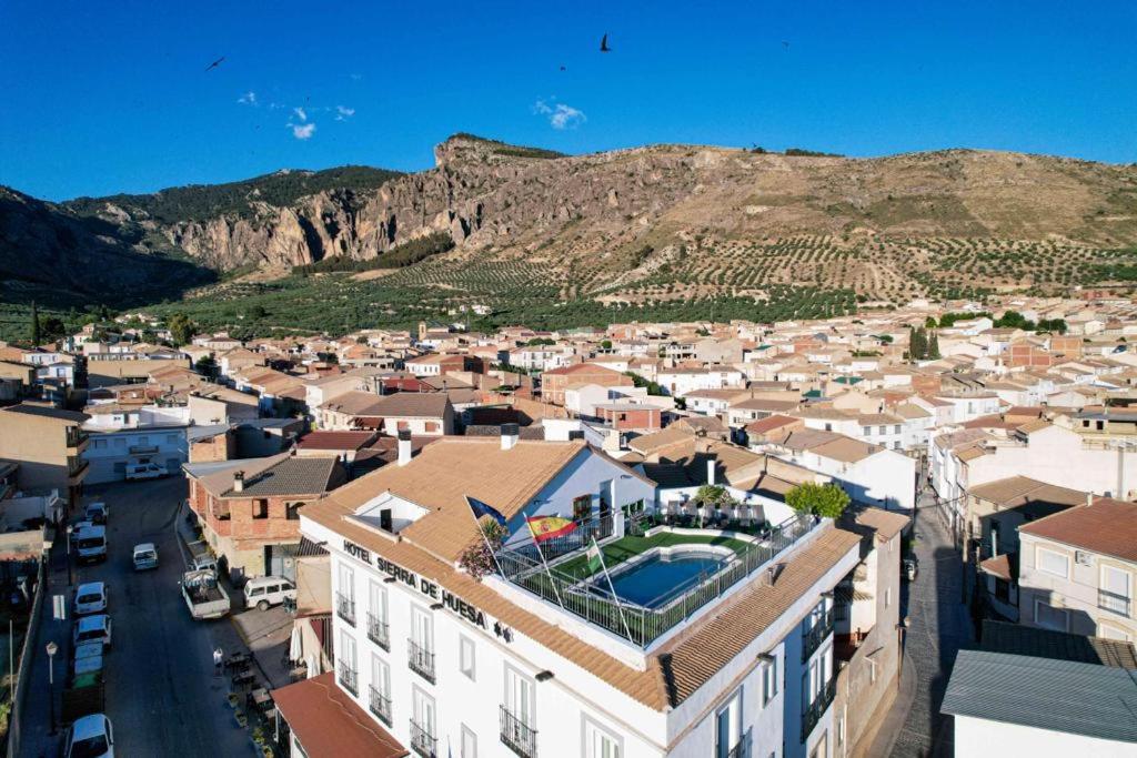 an aerial view of a city with a mountain at Hotel Sierra de Huesa in Huesa