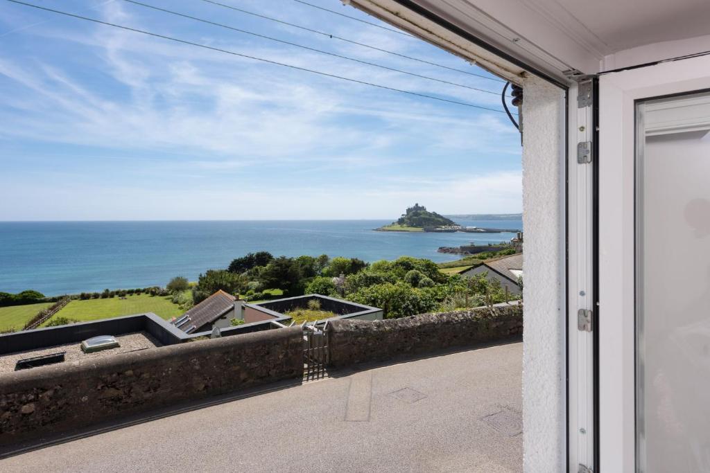a view of the ocean from the balcony of a house at Nutshell, Marazion in Marazion