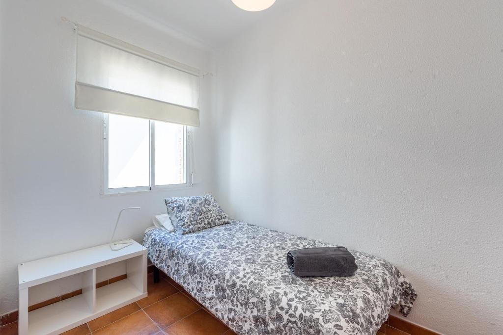 Posteľ alebo postele v izbe v ubytovaní Apartamento Residencial Limonar