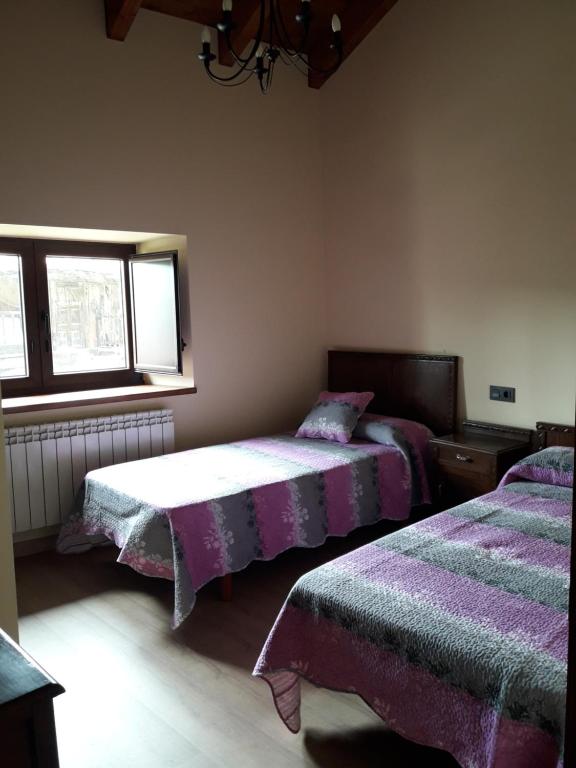 Postel nebo postele na pokoji v ubytování LAS CASINAS DE ARBAZAL