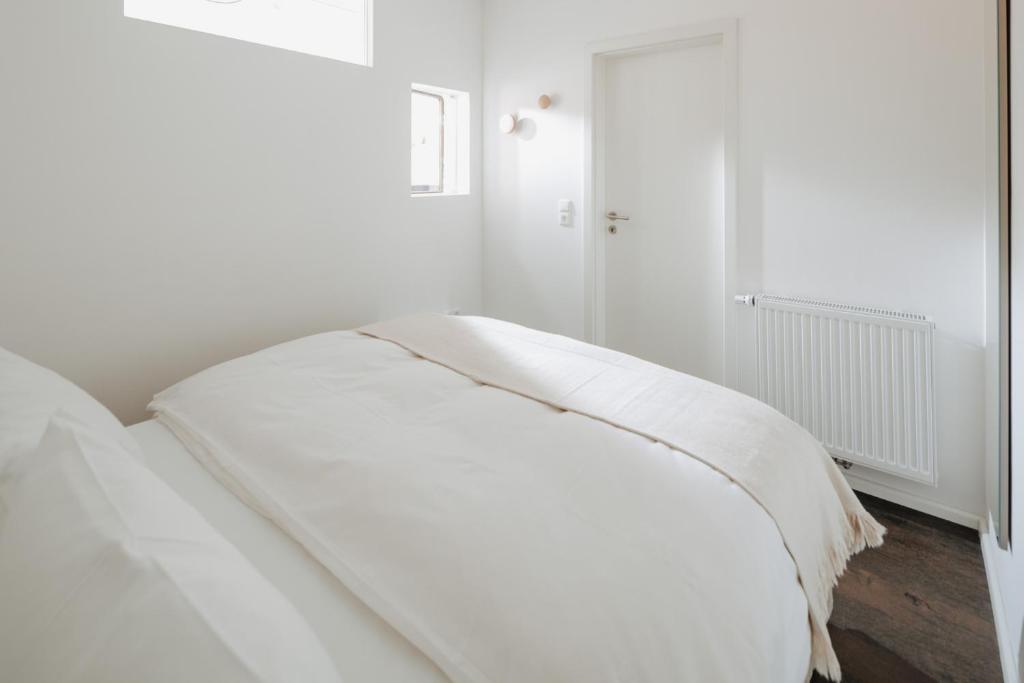 Postel nebo postele na pokoji v ubytování Haus Salz&Sand Wohnung Salz