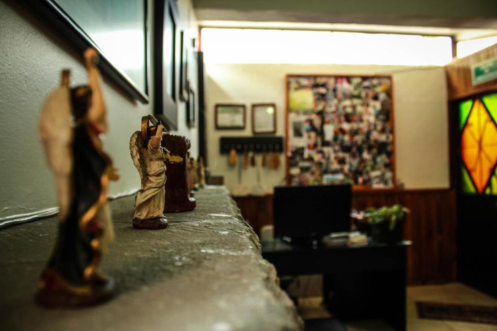 a toy soldier standing on a counter in a room at El Hogar de Carmelita in Guanajuato