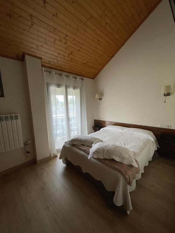 Postel nebo postele na pokoji v ubytování Hotel Avet