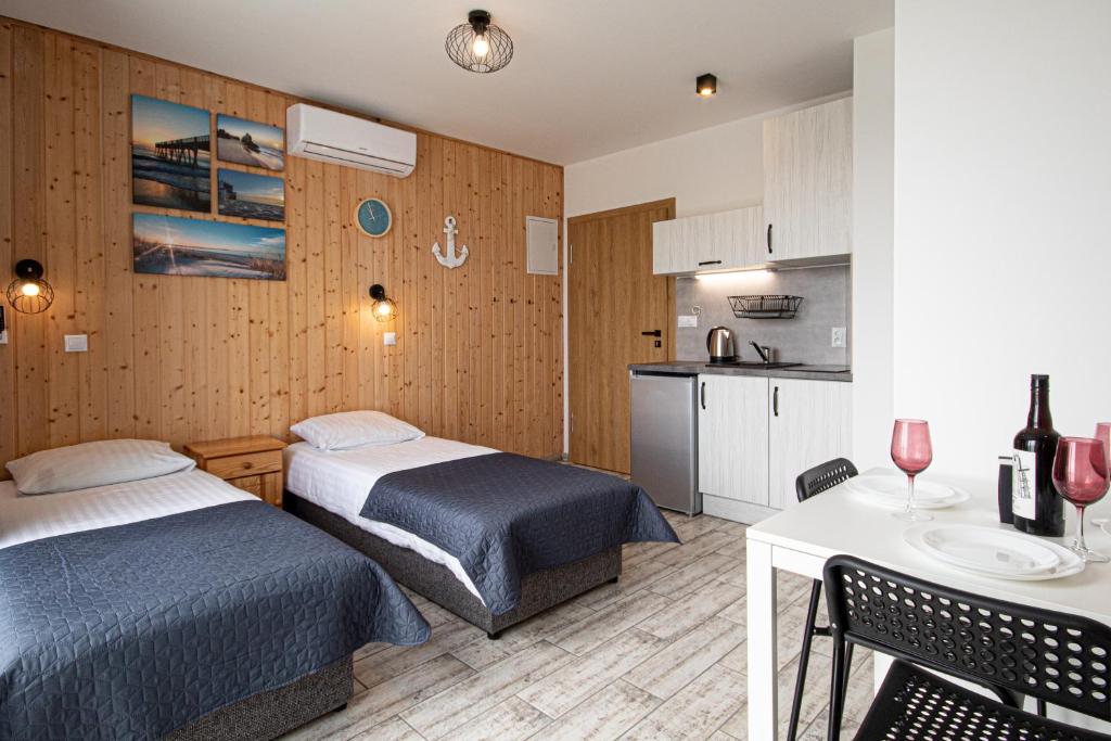 Postel nebo postele na pokoji v ubytování Domki i Apartamenty Al Mare