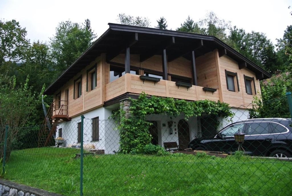 a house with a car parked in front of it at Komfort Chalet in Itter