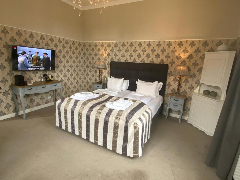 Postel nebo postele na pokoji v ubytování Bandholm Badehotel