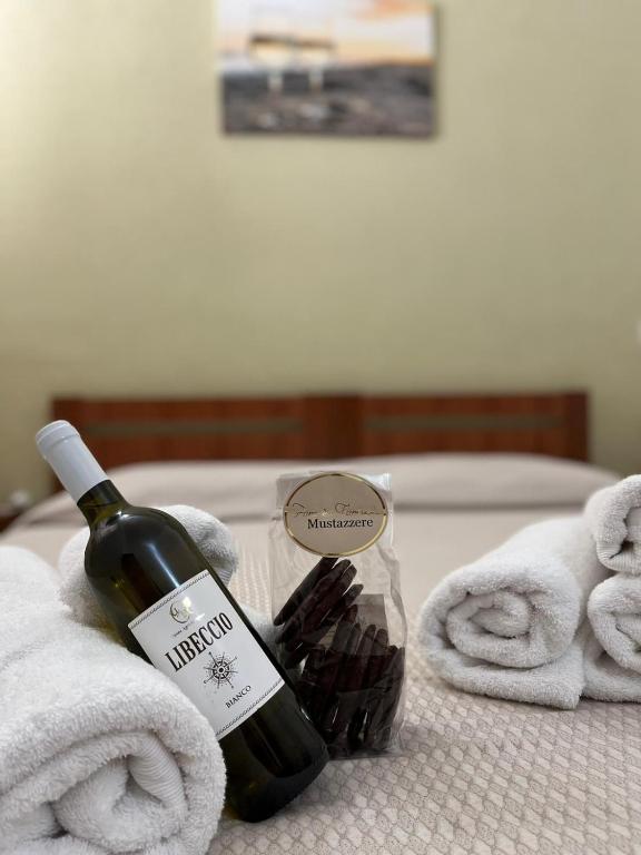 Postel nebo postele na pokoji v ubytování Krasì B&B