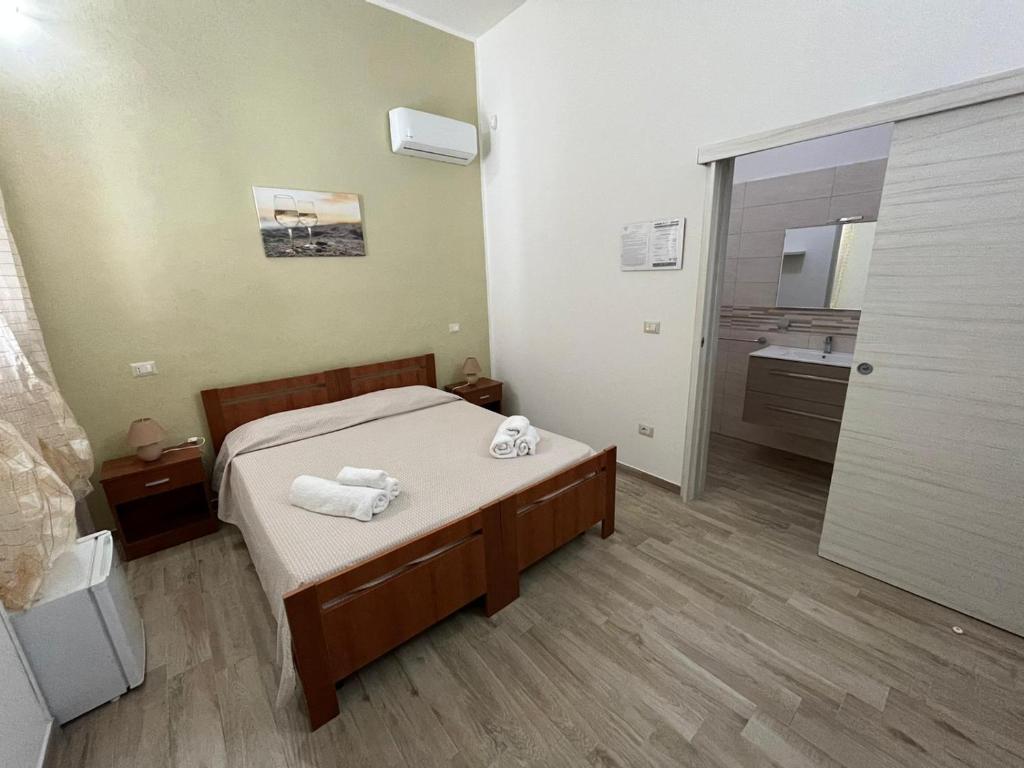 Postel nebo postele na pokoji v ubytování Krasì B&B