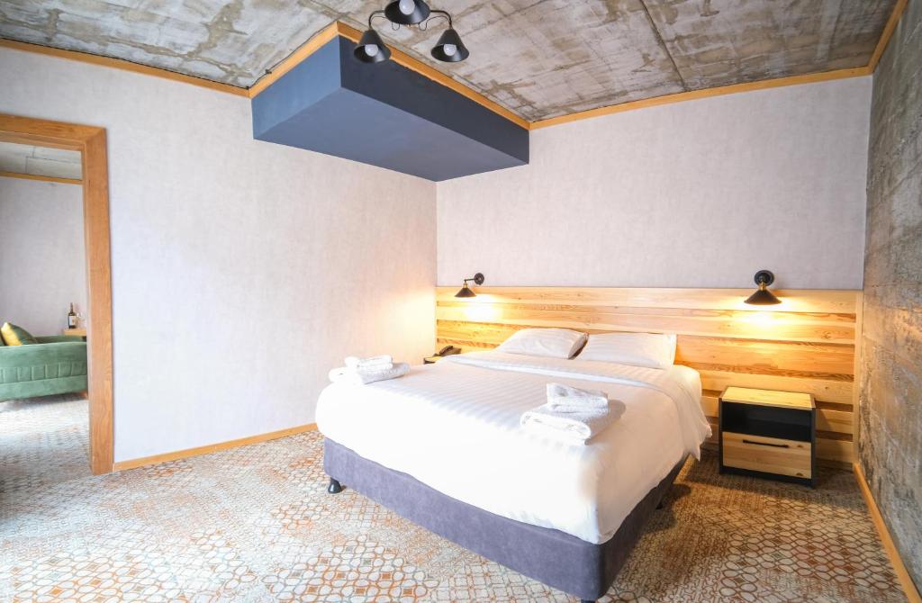 Postel nebo postele na pokoji v ubytování Hotel Posta
