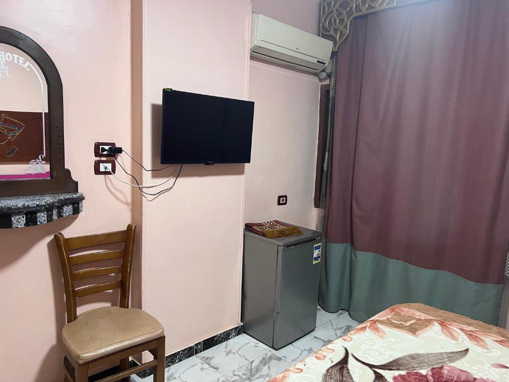 TV a/nebo společenská místnost v ubytování Tiba Hotel