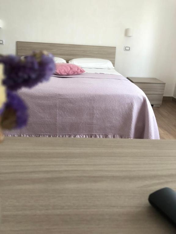 A bed or beds in a room at B&B Belli Dentro