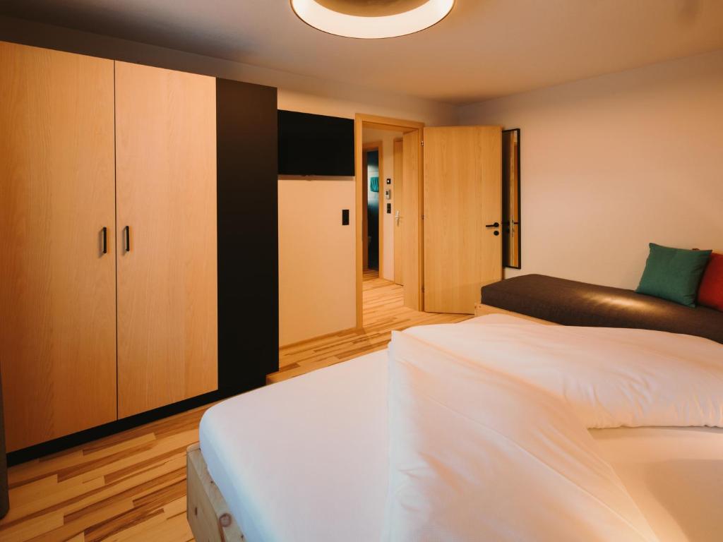 Posteľ alebo postele v izbe v ubytovaní Alpin - Studios & Suites