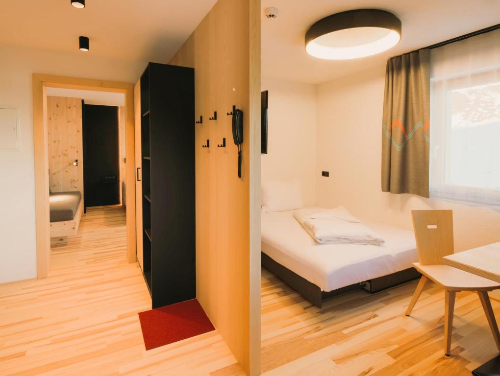 Posteľ alebo postele v izbe v ubytovaní Alpin - Studios & Suites